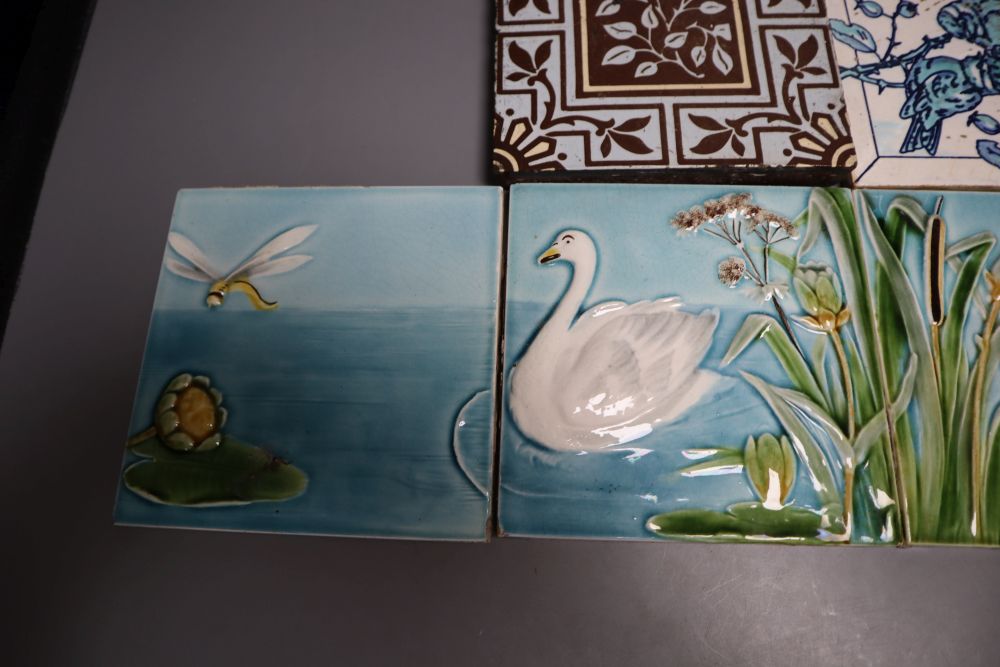 A set of four Victorian coloured tiles, 15cm and two other tiles